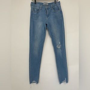 Levi’s light wash super skinny distressed jeans. Size waist: 30 length: 32